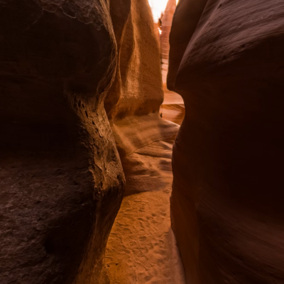 a person with dark hair and a sunset in the background