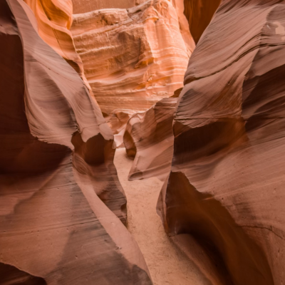 a person sitting at a canyon